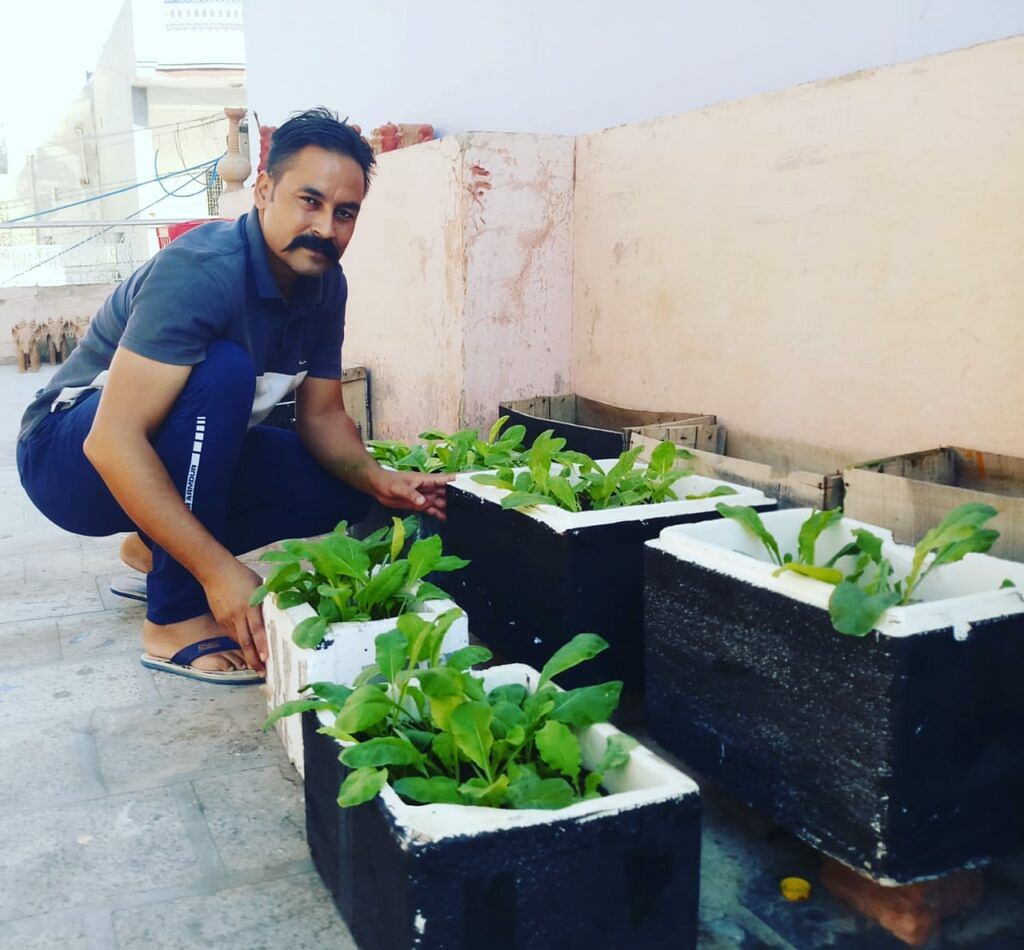 Vijay taking care of plants
